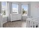 Bright bedroom with natural light, hardwood floors and neutral paint scheme at 12653 Palapa Loop, Spring Hill, FL 34610