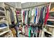 Walk-in closet with ample storage space, shelving, and well-organized clothing racks at 12653 Palapa Loop, Spring Hill, FL 34610