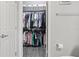 A bedroom closet that is neatly organized with clothing hung and boxes stored above at 12653 Palapa Loop, Spring Hill, FL 34610