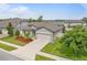 Charming one-story home with a two car garage, well manicured lawn, and attractive landscaping at 12653 Palapa Loop, Spring Hill, FL 34610