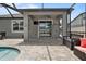 Covered outdoor patio with a ceiling fan and sliding glass doors for easy indoor-outdoor flow at 12653 Palapa Loop, Spring Hill, FL 34610