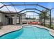 Screened-in pool and patio area, perfect for outdoor entertaining with lounge furniture and ample space at 12653 Palapa Loop, Spring Hill, FL 34610