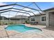 Screened-in pool and patio area offers great outdoor space at 12653 Palapa Loop, Spring Hill, FL 34610