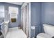 Cozy blue bathroom featuring a shower-tub combination and tiled flooring at 13000 90Th Ave, Seminole, FL 33776