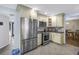 Modern kitchen with stainless steel appliances and ample storage space at 13000 90Th Ave, Seminole, FL 33776
