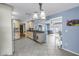 Bright, open kitchen with tile flooring extending to the living area and outdoor views at 13000 90Th Ave, Seminole, FL 33776