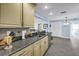 Spacious kitchen featuring gray granite countertop and stainless steel appliances at 13000 90Th Ave, Seminole, FL 33776