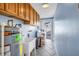 Functional laundry room with overhead cabinets, utility sink and backyard access at 13000 90Th Ave, Seminole, FL 33776