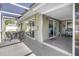 Extended screened-in patio provides multiple seating areas and access to living spaces at 13000 90Th Ave, Seminole, FL 33776