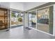 Spacious screened-in patio offers seamless indoor/outdoor living with access to the backyard at 13000 90Th Ave, Seminole, FL 33776