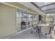 Inviting screened-in patio offering multiple seating areas perfect for outdoor gatherings at 13000 90Th Ave, Seminole, FL 33776