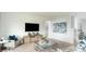 Comfortable living room with stylish furnishings, accent wall, large tv, and cozy decor at 13576 Tropical Breeze Way, Hudson, FL 34669