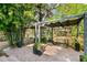 Outdoor space featuring a shaded patio area, surrounded by lush bamboo at 1402 E Mohawk Ave, Tampa, FL 33604