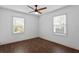 Bedroom with great natural light and hardwood floors; two windows provide ample light at 1402 E Mohawk Ave, Tampa, FL 33604