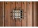 Close-up of the wooden front door with ironwork and decorative details at 1402 E Mohawk Ave, Tampa, FL 33604