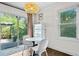 Eat-in kitchen features backyard access, a breakfast nook, and a stylish light fixture at 1402 E Mohawk Ave, Tampa, FL 33604