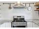 Modern kitchen featuring stainless steel appliances, designer backsplash and granite countertops at 1402 E Mohawk Ave, Tampa, FL 33604
