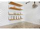 Open shelving adds to the charm of this stylish kitchen with speckled granite countertops at 1402 E Mohawk Ave, Tampa, FL 33604