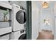 Conveniently placed laundry area with modern stacked washer and dryer at 1402 E Mohawk Ave, Tampa, FL 33604