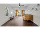 Inviting living room with natural light, wood-look tile flooring, and a daybed perfect for relaxing at 1402 E Mohawk Ave, Tampa, FL 33604