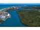 Expansive aerial view showcases the coastal community with beach, waterways, and lush mangrove islands at 17920 Gulf Blvd # 1901, Redington Shores, FL 33708