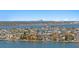 Breathtaking aerial view showcasing waterfront homes with lush greenery, with a distant city skyline at 17920 Gulf Blvd # 1901, Redington Shores, FL 33708