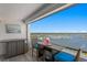 Balcony with seating area and picturesque waterfront views, creating a tranquil outdoor space at 17920 Gulf Blvd # 1901, Redington Shores, FL 33708