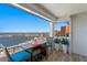Enjoy gorgeous views from this balcony featuring a table and chairs for relaxing at 17920 Gulf Blvd # 1901, Redington Shores, FL 33708