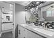 Modern bathroom with double sinks, updated tile backsplash, and glass enclosed shower at 17920 Gulf Blvd # 1901, Redington Shores, FL 33708