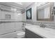 Modern bathroom features tiled shower, sleek vanity, elegant mirror, and contemporary fixtures at 17920 Gulf Blvd # 1901, Redington Shores, FL 33708