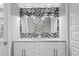 Beautiful bathroom featuring double sinks, granite countertop, mosaic backsplash and modern lights at 17920 Gulf Blvd # 1901, Redington Shores, FL 33708