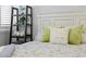 Cozy bedroom featuring a beautifully decorated bed, shelving unit, and stylish decorative accents at 17920 Gulf Blvd # 1901, Redington Shores, FL 33708