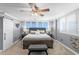 Comfortable bedroom featuring a king bed, neutral carpet, plantation shutters and ensuite bathroom at 17920 Gulf Blvd # 1901, Redington Shores, FL 33708