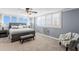 Bright bedroom featuring a king bed, neutral palette, plantation shutters and coastal decor at 17920 Gulf Blvd # 1901, Redington Shores, FL 33708