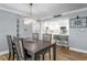 Elegant dining room featuring modern lighting and stylish decor adjacent to the kitchen at 17920 Gulf Blvd # 1901, Redington Shores, FL 33708