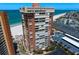 Beautiful exterior view of high-rise condominium building, next to beach and street side parking at 17920 Gulf Blvd # 1901, Redington Shores, FL 33708
