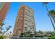 Tall luxury beachfront condo with balconies and tropical palm trees at 17920 Gulf Blvd # 1901, Redington Shores, FL 33708