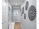 Light and airy hallway with stylish decor and modern finishes, bench seating, and lots of natural light at 17920 Gulf Blvd # 1901, Redington Shores, FL 33708