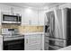Beautifully remodeled kitchen with stainless steel appliances and new backsplash at 17920 Gulf Blvd # 1901, Redington Shores, FL 33708