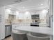 Modern kitchen featuring white cabinets, stainless steel appliances and a large center island at 17920 Gulf Blvd # 1901, Redington Shores, FL 33708