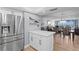 Modern kitchen with stainless steel appliances, marble counters, and an open concept to the living area at 17920 Gulf Blvd # 1901, Redington Shores, FL 33708