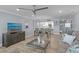 Open-concept living room with a dining area and a glimpse of the kitchen at 17920 Gulf Blvd # 1901, Redington Shores, FL 33708