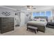 Well-appointed main bedroom featuring a sliding barn door to bathroom, plenty of light and a dresser at 17920 Gulf Blvd # 1901, Redington Shores, FL 33708