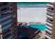 Relaxing poolside view between beachfront highrise towers, showcasing resort-style living at its finest at 17920 Gulf Blvd # 1901, Redington Shores, FL 33708