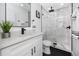 Modern bathroom with white vanity, sleek black fixtures, glass-enclosed shower, and stylish accents at 1873 Murray Ave, Clearwater, FL 33755