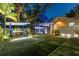 Enjoy the tranquility of this backyard with a jacuzzi, outdoor kitchen, and meticulously maintained lawn at 213 N Hesperides St, Tampa, FL 33609