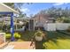 This modern backyard with a jacuzzi under a pergola, is perfect for outdoor living and entertaining at 213 N Hesperides St, Tampa, FL 33609