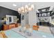 Bright dining room features modern lighting, a glass table, and an open floor plan at 213 N Hesperides St, Tampa, FL 33609