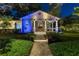 Beautiful home exterior featuring a covered porch, manicured landscaping, and elegant walkway at 213 N Hesperides St, Tampa, FL 33609