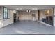 Spacious garage featuring ample storage, epoxy flooring, and washer/dryer hookups at 213 N Hesperides St, Tampa, FL 33609